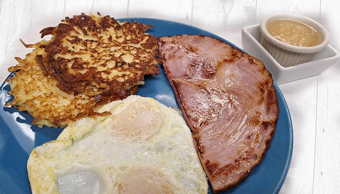 Pine Cone Café Land O' Lakes, WI eggs over easy with hash browns and ham slice