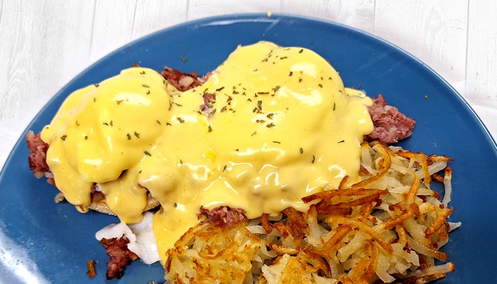 Breakfast hash served with hash browns, eggs topped with hollandaise sauce at Pine Cone Café in Land O' Lakes, WI